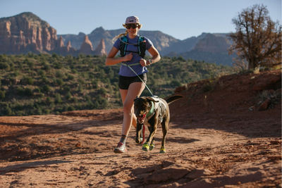 Woman running with her dog.