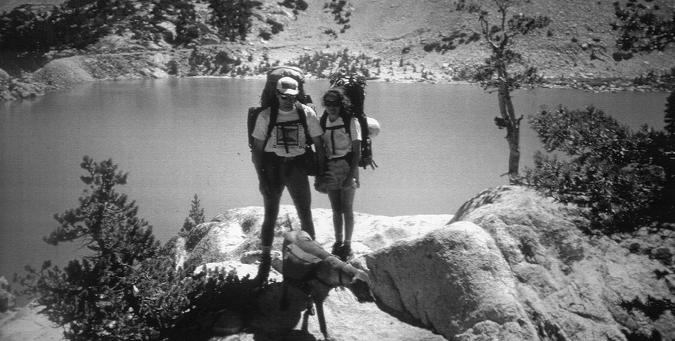 A historical picture of Ruffwear founder Patrick Kruse, his friend, and a dog..