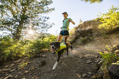 Woman running with her dog.